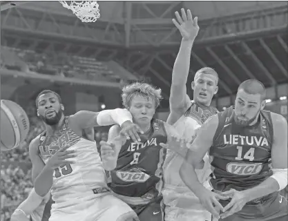  ?? EMILIO MORENATTI/AP ?? U.S. and Lithuania players challenge for the ball during their Basketball World Cup semifinal. The United States won the match 96-68.