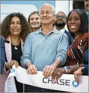  ?? ANDRES KUDACKI/AP ?? Jamie Dimon, CEO of JPMorgan Chase, touts “community center” branches that include programmin­g such as financial literacy workshops.