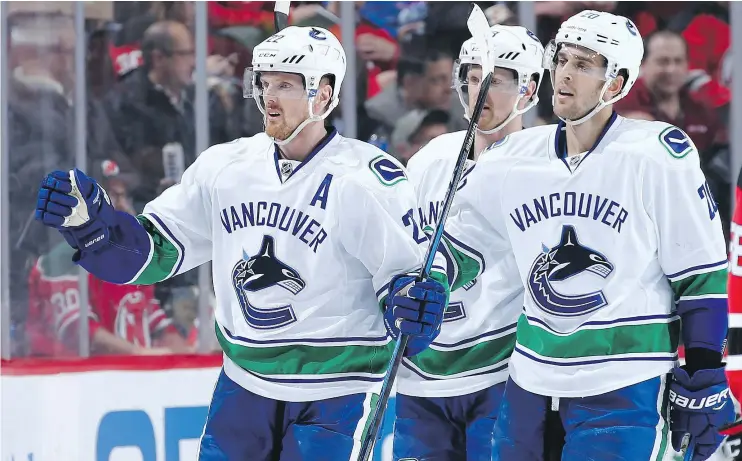  ?? — PHOTOS: GETTY IMAGES FILES ?? Daniel Sedin, left, and the Vancouver Canucks enter Friday’s game against the Tampa Bay Lightning with 26 points, sixth in the Pacific Division.