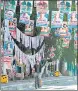  ?? REUTERS ?? A man rides a cycle past the election posters in Quezon city, Metro Manila.