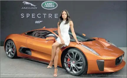  ?? Spectre, ?? SUPER SLEEK: Naomie Harris, who plays Miss Moneypenny in the James Bond film
and the Jaguar CX75.