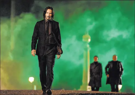 ?? Murray Close The Associated Press ?? Keanu Reeves stars as John Wick in “John Wick 4,” as seen in an image provided to The Associated Press by the film’s producer, Lionsgate. The film debuted with a franchise-best $73.5 million at the box office.
