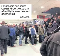  ?? Jon Lewis ?? Passengers queuing at Cardiff Airport yesterday after flights were delayed or cancelled