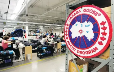  ?? —CP ?? Workers stitch together coats at the Canada Goose factory in Toronto. The company is adding “cold rooms” to stores where customers can put the coats to the test.