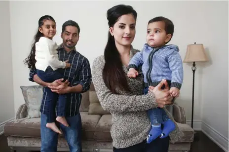  ?? ANDREW FRANCIS WALLACE/TORONTO STAR ?? Davinder, left, and Manpreet Kaler with their children Simer, 4, and Amar, 8 months, at their Caledon home. When Manpreet gave birth to her son, she joined a growing number of women donating cord blood to the country’s public bank, because the stem cell-rich material would be wasted otherwise.