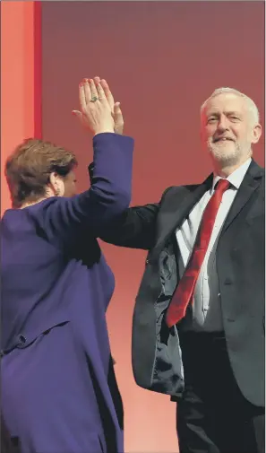  ?? PICTURES: PA WIRE. ?? HIGH FIVE: Labour leader Jeremy Corbyn congratula­tes shadow foreign secretary Emily Thornberry following her speech at the Labour Party conference at the Brighton Centre