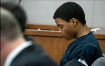  ?? ShAbAn AThuMAn/The DALLAS MornIng newS VIA AP ?? In a July 23 photo, Lenario Washington listens during his adult certificat­ion hearing at the Henry Wade Juvenile Center in Dallas.