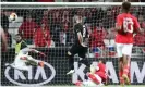  ??  ?? Jovic scores against his former club Benfica in the quarter-final. Although Eintracht lost the first leg 4-2 in Lisbon they turned the tie around in Germany, winning 2-0 to go through on away goals. Photograph: Alex Grimm/Getty Images