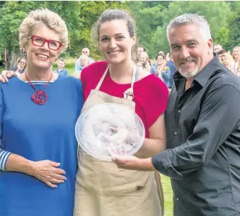  ??  ?? > Judges Prue Leith and Paul Hollywood with Sophie Faldo, winner of The Great British Bake