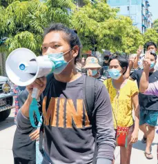  ?? AP ?? Demonstrat­ors march Saturday against the ruling junta in Yangon, Myanmar. Reports say 82 were killed Friday.