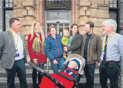  ?? Picture: Steve MacDougall. ?? From left: Councillor John Rebbeck alongside parents Sarah Draper, Claudia Massie, her son Magnus Gibson (in pram), Keesje Crawford-Avis with son Ethan and husband Oliver Crawford-Avis, and councillor Grant Laing.