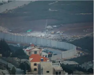  ?? (Ronen Zvulun/Reuters) ?? ISRAELI DRILLING equipment works to locate and destroy Hezbollah attack tunnels next to the security barrier with Lebanon last month.