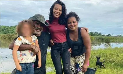  ?? Photograph: Handout ?? Márcia Nunes Lisboa and her husband José Gomes with their two children. The family bred baby turtles to repopulate the river.