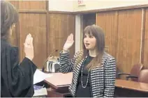  ?? HALEY MOSS/COURTESY ?? Miami-Dade Circuit Judge Lisa Walsh administer­s the oath to Haley Moss on Jan. 11 at the Richard E. Gerstein Justice Building in Miami. Moss is the first openly autistic person admitted to the Florida Bar.