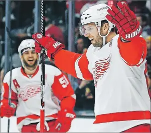  ?? AP PHOTO ?? In this Jan. 5 file photo, then-Detroit Red Wings left wing Thomas Vanek (right) celebrates his goal during the first period of an NHL game against the Los Angeles Kings in Los Angeles.