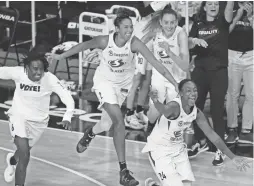  ?? AP ?? Seattle Storm players rush the court after they defeated the Las Vegas Aces to win the WNBA championsh­ip on Tuesday in Bradenton, Fla.