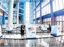  ?? JOE BURBANK/ORLANDO SENTINEL ?? The Disney Atrium was filled with polling booths during early voting for Orange County residents at the Amway Center.