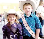  ?? MARK HUMPHREY ENTERPRISE-LEADER ?? Siblings Emma (left) and Ethan Parker competed for the titles of Lil’ Miss and Lil’ Mister during the 2017 Lincoln Rodeo. Ethan won the Lil’ Mister title while Emma is again competing for Lil’ Miss this year. The 2018 contest starts at 7 p.m. at the Lincoln Square prior to the street dance which starts at 8 p.m. on Wednesday, Aug. 8.