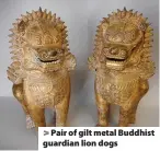  ??  ?? Pair of gilt metal Buddhist guardian lion dogs