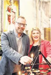  ?? PHOTO: JOHN McELROY ?? Light of love: Emer Duffy and Killian Casey at the shrine of St Valentine in the Whitefriar Street Church in Dublin yesterday.