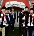  ??  ?? The students posing at the entrance of the “tunnel” through which famous footballer­s have walked to enter the stadium.