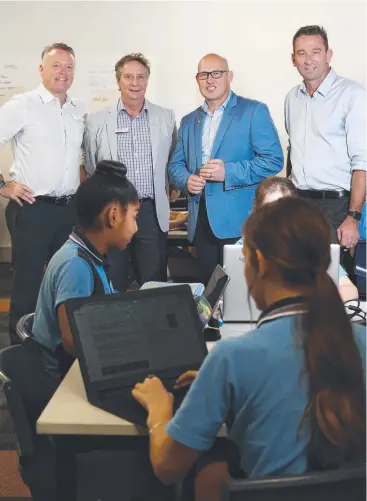  ?? Picture: BRENDAN RADKE ?? BIG BOOST: Labor candidate for Cairns Michael Healy, Smithfield State High School principal Barry Courtney, Treasurer Curtis Pitt and the Member for Barron River Craig Crawford – Smithfield and Trinity Beach State School are in line for $10m funding...