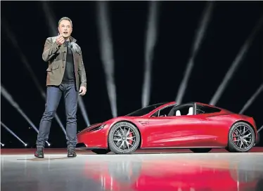  ??  ?? ELECTRIC CAR STAR: Tesla CEO Elon Musk, unveiling the Roadster 2 in this file photo, is considerin­g taking the company private