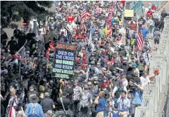  ?? REUTERS ?? Right-wing supporters of the Patriot Prayer group march during a rally in Portland on Saturday.