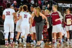  ?? SUBMITTED PHOTO ?? Media native and Academy of Notre Dame alum Katie Kuester, center, has been promoted to assistant women’s basketball coach at her alma mater, Saint Joseph’s.