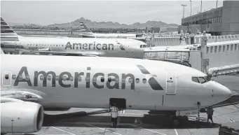  ?? Jenny Kane/Associated Press ?? American has the most debt among all U.S. airlines, more than $36 billion. The airline is trying to fly through a bumpy recovery in travel.