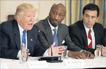  ?? Evan Vucci Associated Press ?? PRESIDENT TRUMP meets in February with manufactur­ing executives, including Merck Chief Executive Ken Frazier, center, and then-Ford CEO Mark Fields. Frazier has resigned from the president’s council.