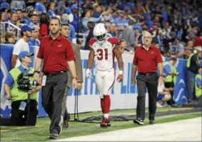  ?? JOSE JUAREZ - THE ASSOCIATED PRESS ?? Arizona Cardinals running back David Johnson (31) walks off the field with medical staff for X-rays during an NFL football game against the Detroit Lions in Detroit, Sunday.