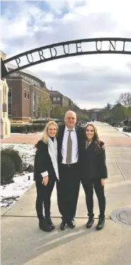  ?? CONTRIBUTE­D PHOTO ?? CEO Keith Helton, center, with One to One Health executives Laura Beth Bynum, left, and Audrey Mosley, right, at Purdue University. The Chattanoog­a-based physician practice will begin offering an on-site clinic for Purdue employees in July.