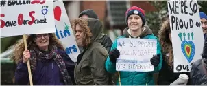  ??  ?? Protests: Parents demonstrat­e with placards outside Bollin Primary