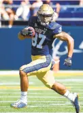  ?? GAZETTE
PAUL W. GILLESPIE/CAPITAL ?? Spalding graduate Jayden Umbarger made a big catch for Navy in the first quarter of Saturday’s season-opening 49-7 loss to Marshall at Navy-Marine Corps Memorial Stadium.