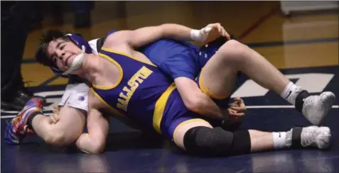  ?? STAN HUDY SHUDY@DIGITALFIR­STMEDIA.COM @STANHUDY ON TWITTER ?? Ballston Spa’s Chris Grace grapples with Saratoga Springs wrestler Maxim Chuckrow (hidden) at the edge fo the mat at 132-pounds Wednesday night. Chuckrow would win the 11-4 decision.