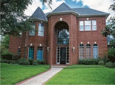  ?? Photos by Mark Mulligan / Staff photograph­er ?? Several homes in the Wimbledon Champions neighborho­od in Spring have been purchased by investors after Harvey and are in various states of repair, from fully remodeled to currently in foreclosur­e.