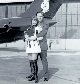  ?? WENN ?? Barbi Benton and Hugh Hefner in front of the iconic Playboy jet in the 1970s.
