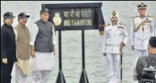  ?? AP ?? Defence minister Rajnath Singh (third from left) during the commission­ing ceremony of INS Khanderi in Mumbai.