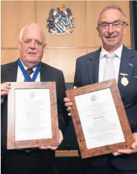  ??  ?? Coun Bernard Dawson and David Lloyd receive their Freedom of the Borough at Accrington Town Hall