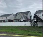  ?? ?? Another look at the damage to a carport at Stony Creek Apartments in Washington Township caused by Wednesday’s storms.