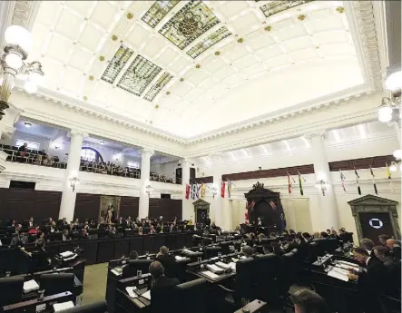  ?? IAN KUCERAK ?? Finance Minister Joe Ceci unveils the budget on the floor of the Alberta Legislatur­e on Thursday. Conspicuou­sly absent from his speech was the $96 billion in deficits the NDP is expected to accumulate by 2023.