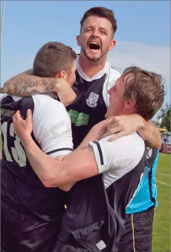  ??  ?? Newtown United players celebrate after their magical victory in the Wicklow Cup final.