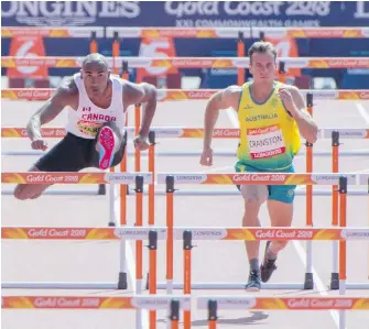  ?? RYAN REMIORZ, THE CANADIAN PRESS ?? Canada’s Damian Warner, left, and Australia’s Kyle Cranston compete in the 110-metre hurdles during the decathlon in Gold Coast, Australia.