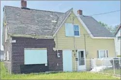  ?? CAPE BRETON POST PHOTO ?? Half of a company house located at 111 Victoria Rd. in Sydney is among 10 properties approved for demolition this week by CBRM council.