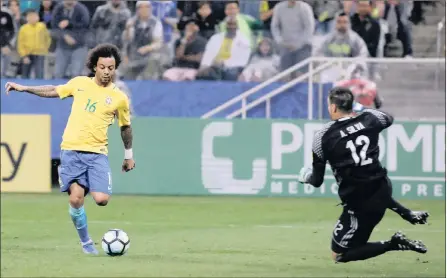  ?? PICTURE: REUTERS ?? ONE-ON-ONE: Brazil’s Marcelo scores past Paraguay’s goalkeeper Antony Silva during last night’s World Cup qualifiers in Sao Paulo.