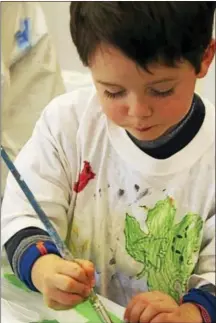  ?? PHOTO COURTESY OF GAC ?? A child artist concentrat­es at the art center.