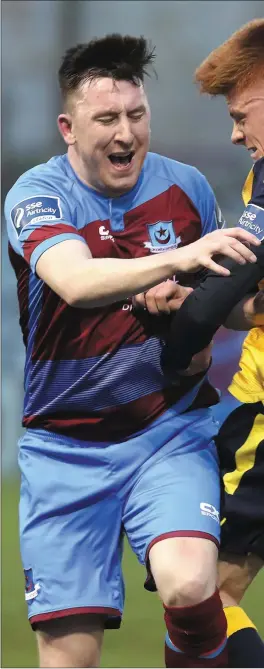  ??  ?? Drogheda United’s Sean Brennan is challenged by Longford Town’s 18-year-old midfielder Aobh Dervin at United Park last Friday.