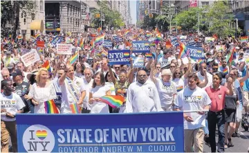  ?? MEL EVANS/ASSOCIATED PRESS ?? Marchers fill the street in New York City on June 26, 2016, during the annual pride parade. This year’s parade will take place Sunday amid protests by some people of color in the LGBT community.