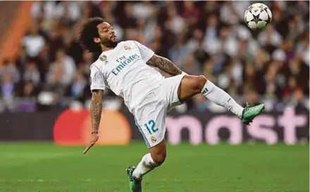  ??  ?? Real Madrid defender Marcelo will have to be at his best if he is to contain Liverpool’s Mohamed Salah in the Champions League final in Kiev on May 26. AFP PIC